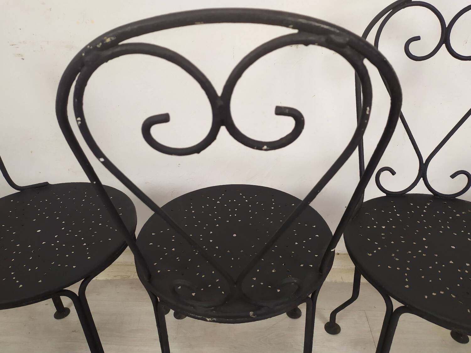 4 black garden chairs