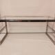 1980s coffee table with a double chrome metal top.