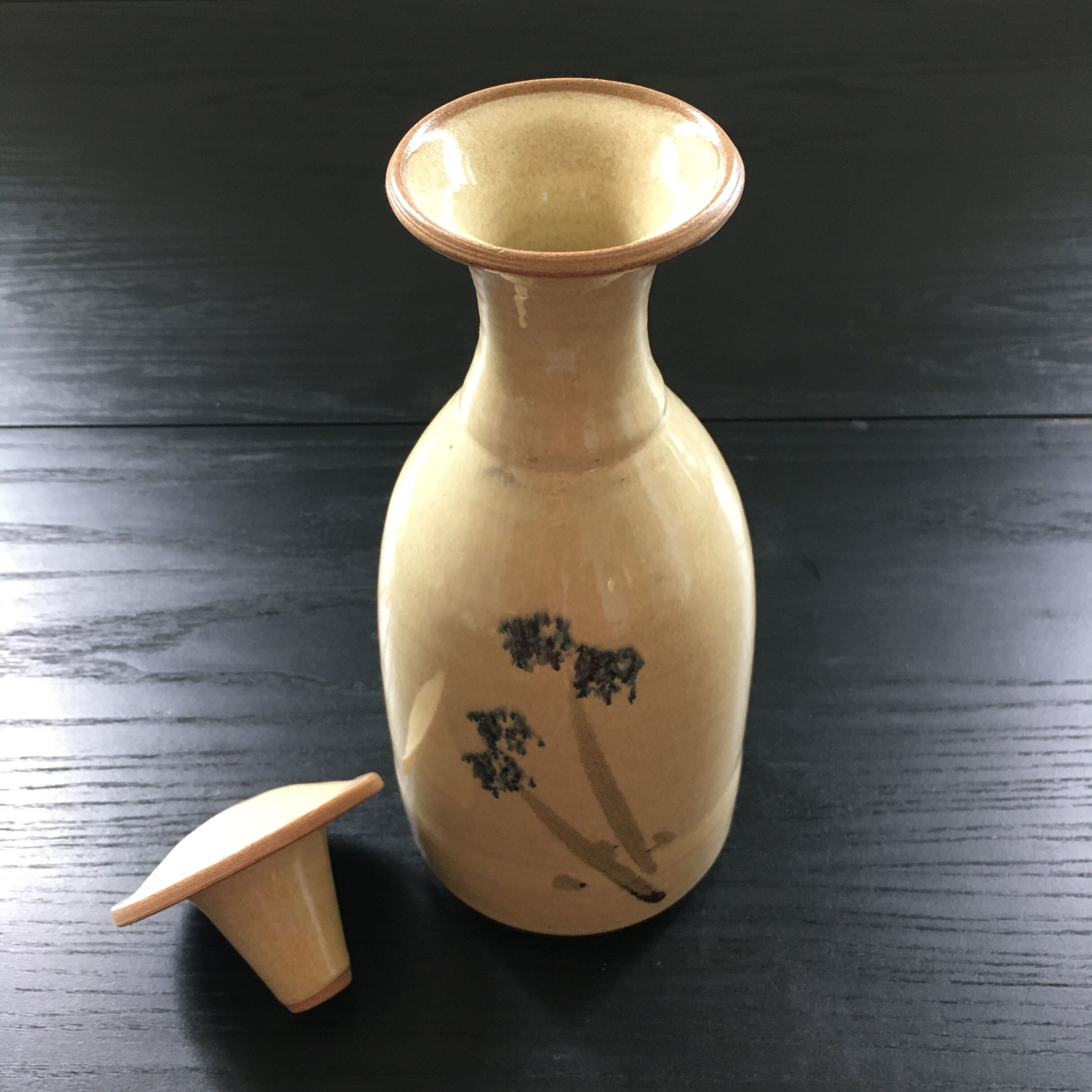 Stoneware carafe with floral decoration