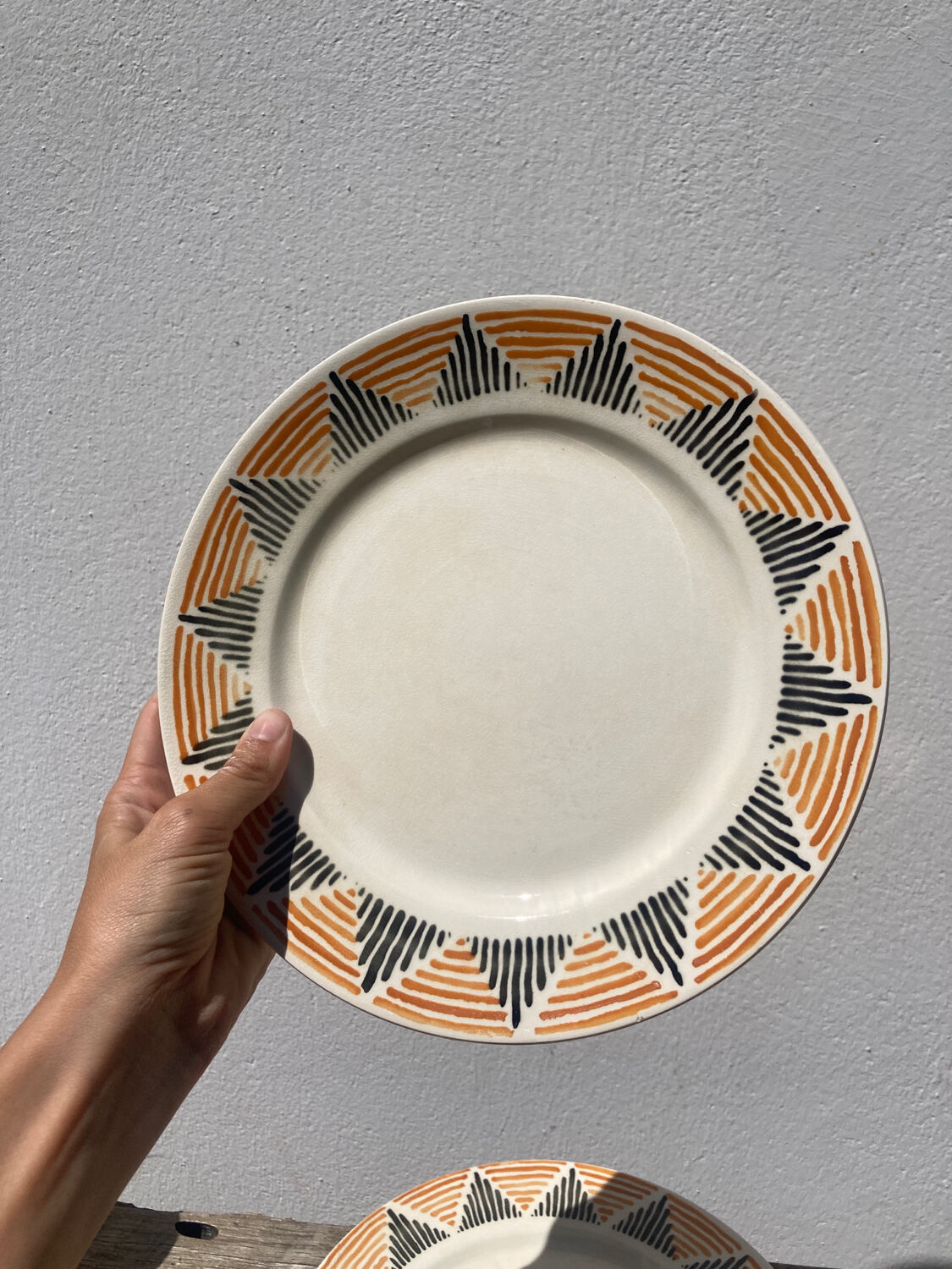 12 flat plates in yellow earthenware Badonviller