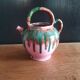 Jug pitcher Provençal earthenware glazed with pink and green glaze.