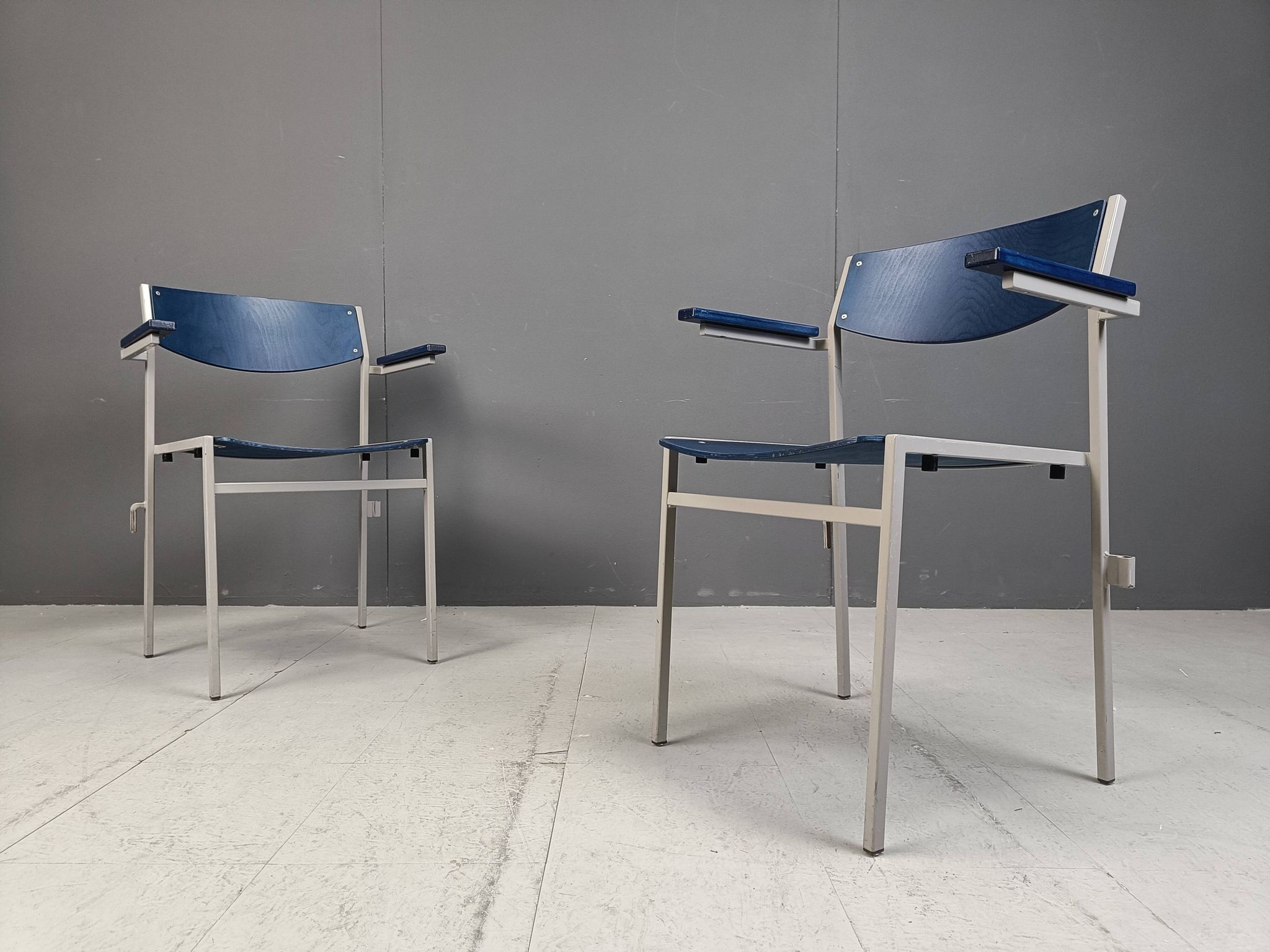 Minimalist metal and plywood stackable armchairs by Gijs Van Der Sluis