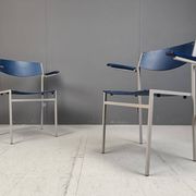Minimalist metal and plywood stackable armchairs by Gijs Van Der Sluis