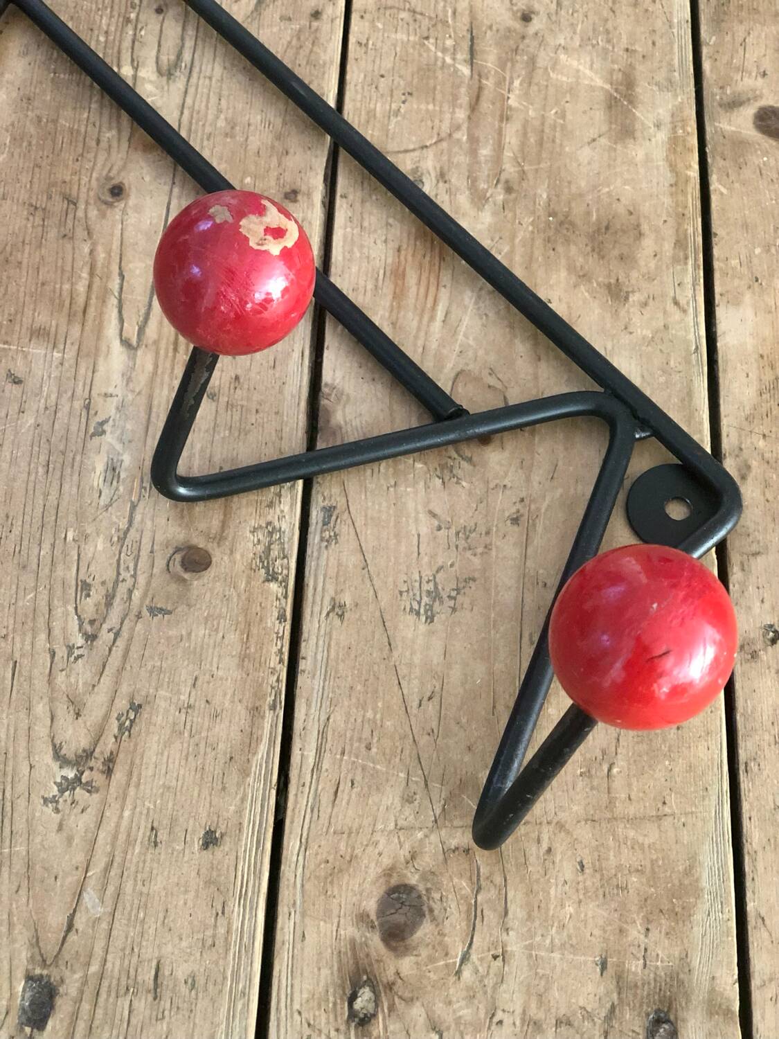 Red and black coat rack
