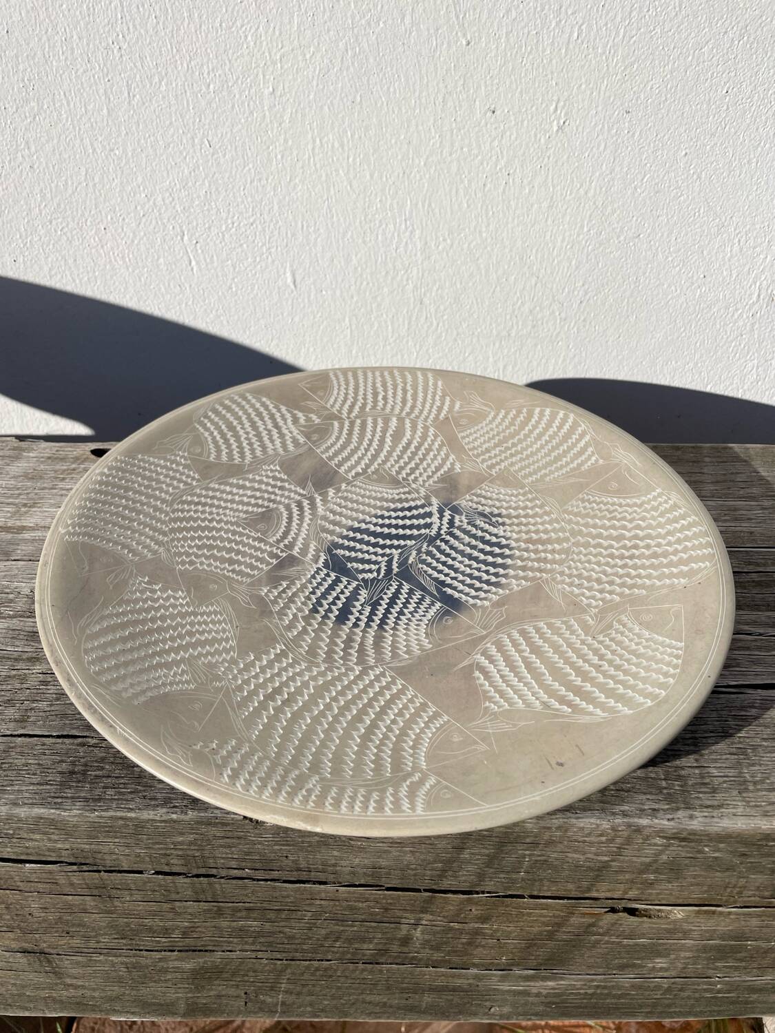 Ethnic handmade round fish dish