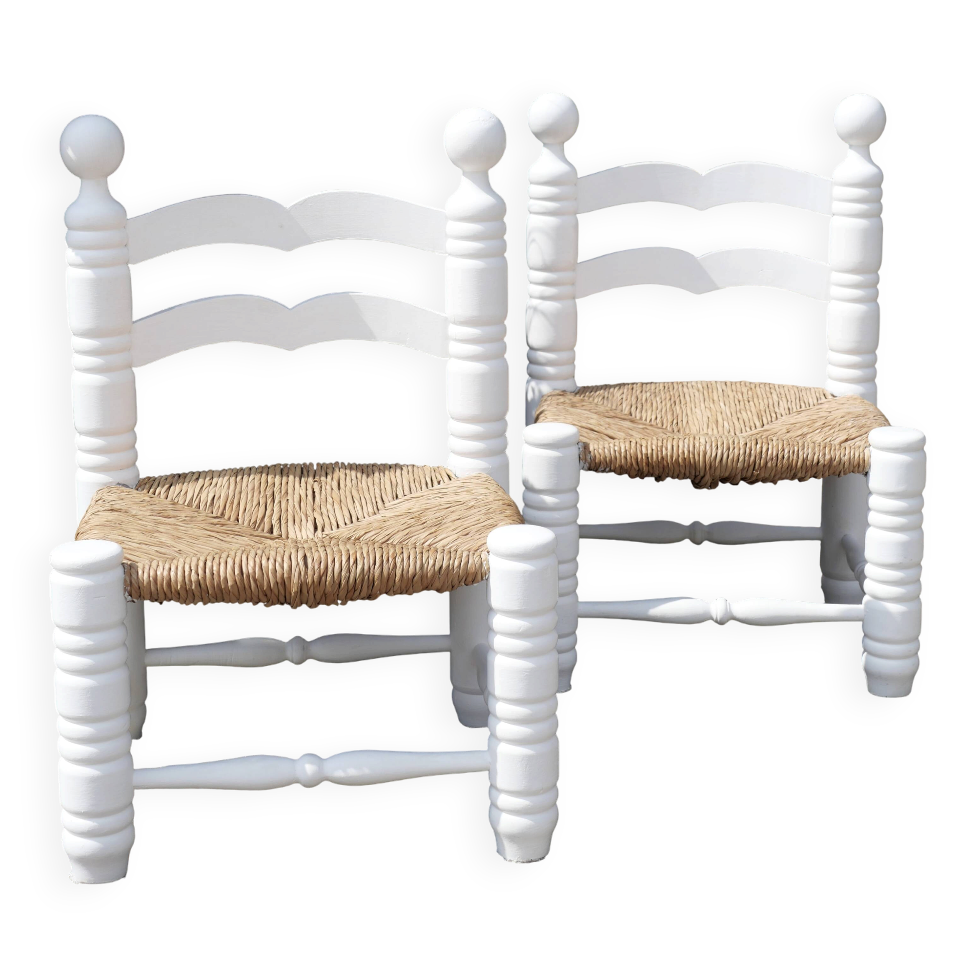 Pair of rush-seated chairs by Charles Dudouyt