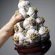 Vintage trompe-l'œil garlic pyramid in glazed ceramic from Manises, Spain.