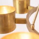 Matte gold brass circular chandelier. Contemporary Italian work.