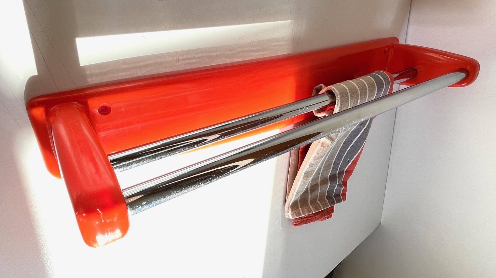 Orange towel rack by Syla from the 70s