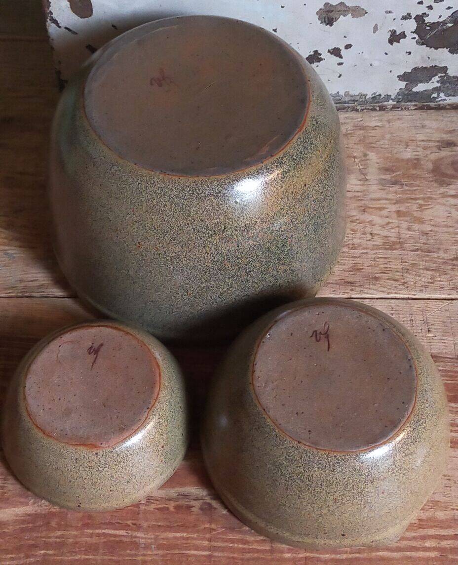 Three nesting pottery salad bowls in glazed stoneware