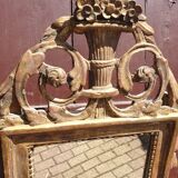 Old mirror in carved and gilded wood
