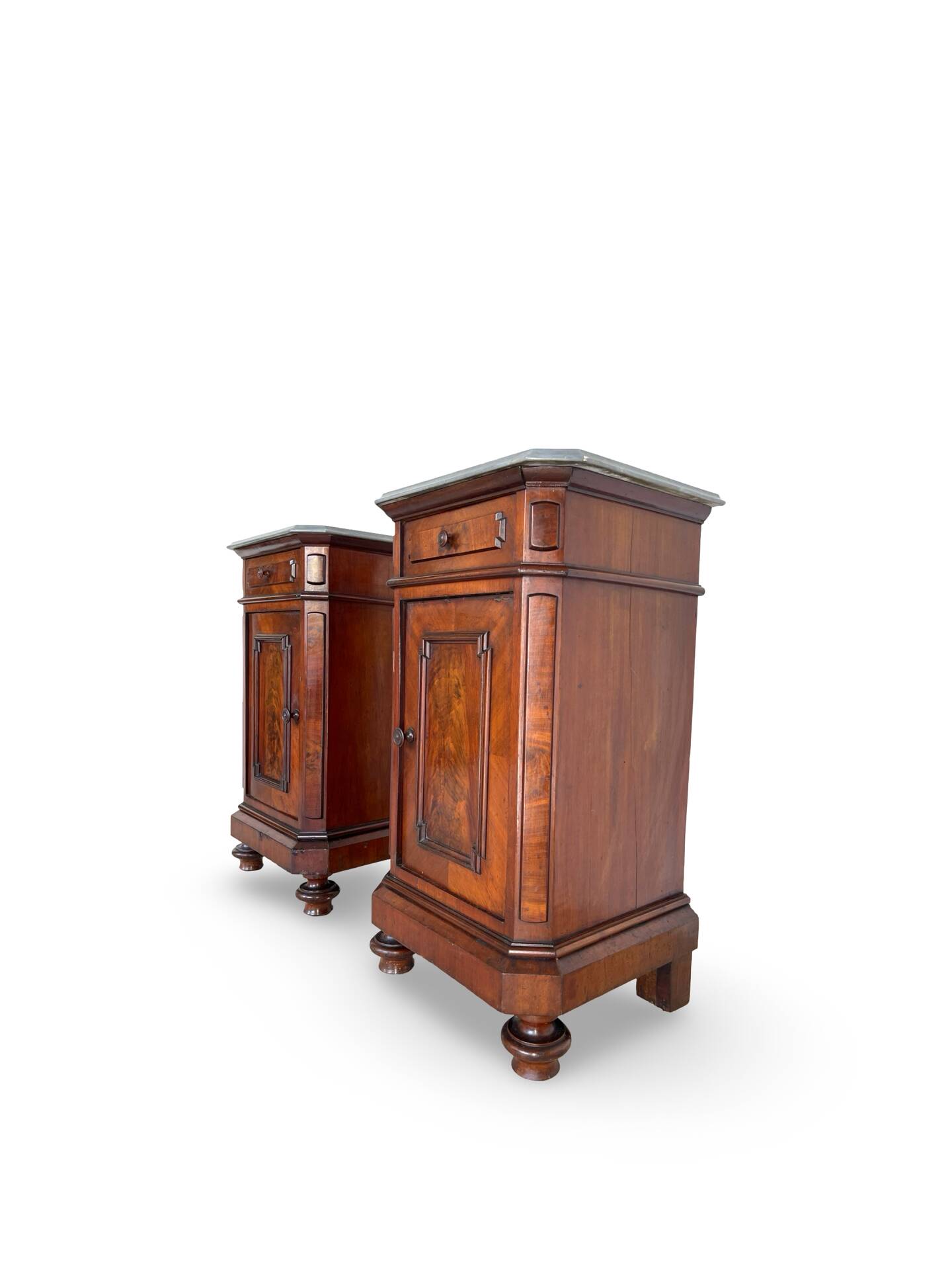 A pair of antique walnut bedside tables from the 1890s.