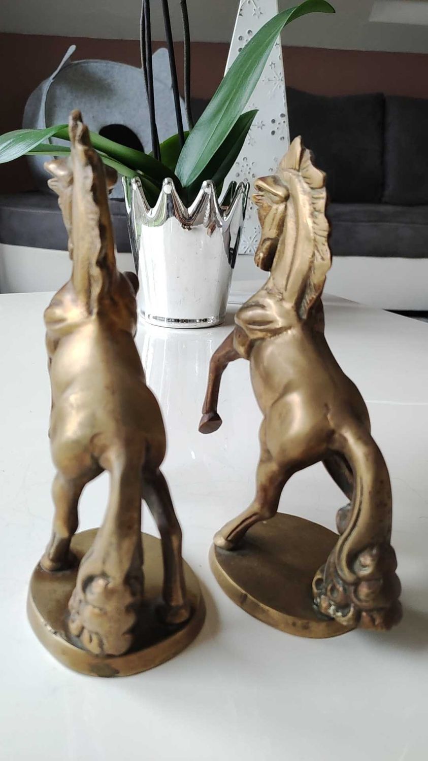 of greenhouse art deco bookends recancing unicorns. solid brass