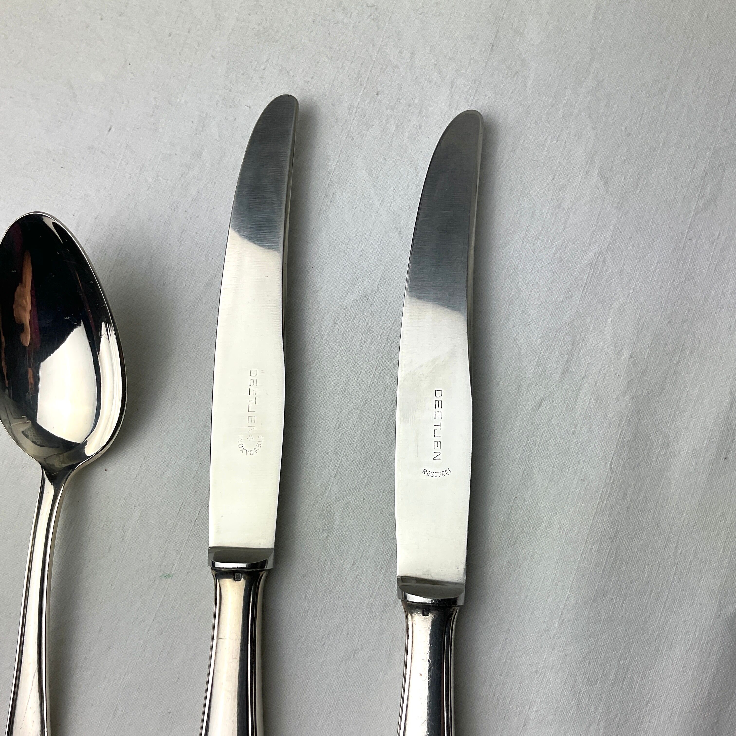 Paire de couteaux et cuillère de table argent Deetjen 100