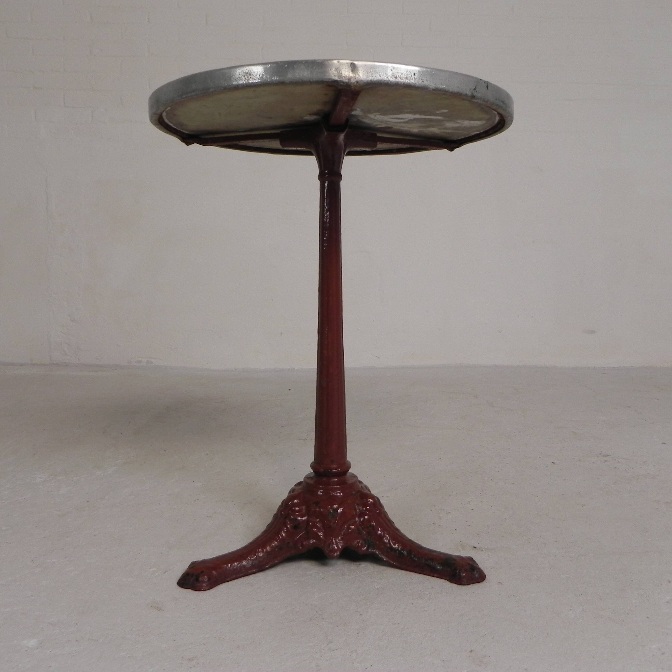 Bistro table with cast iron legs and marble top, 1920s.