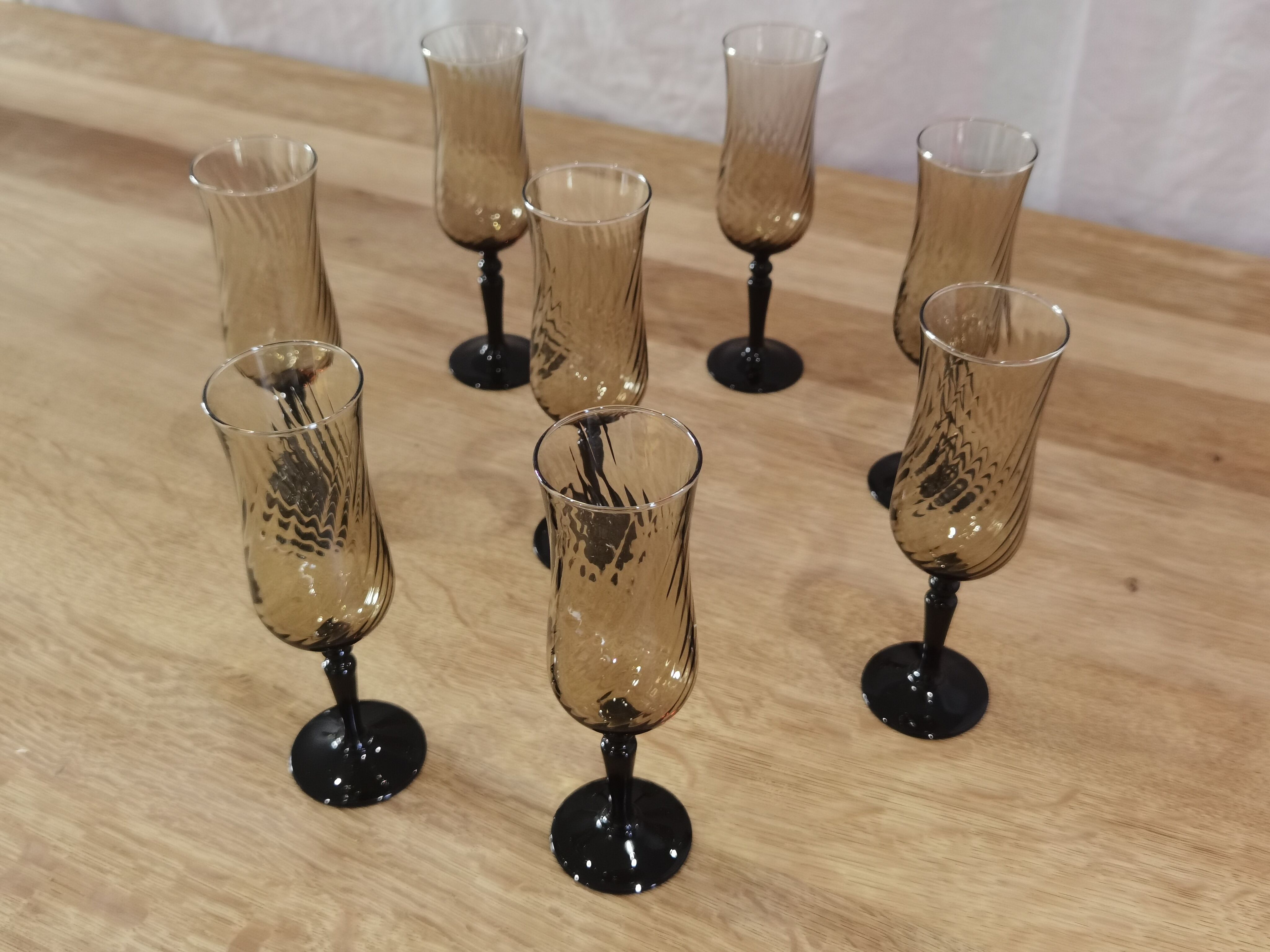 8 vintage smoked champagne flutes with black feet Arcoroc