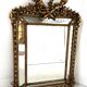 Louis XVI style mirror with parecloses in wood and gilded stucco, 19th century