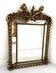 Louis XVI style mirror with parecloses in wood and gilded stucco, 19th century