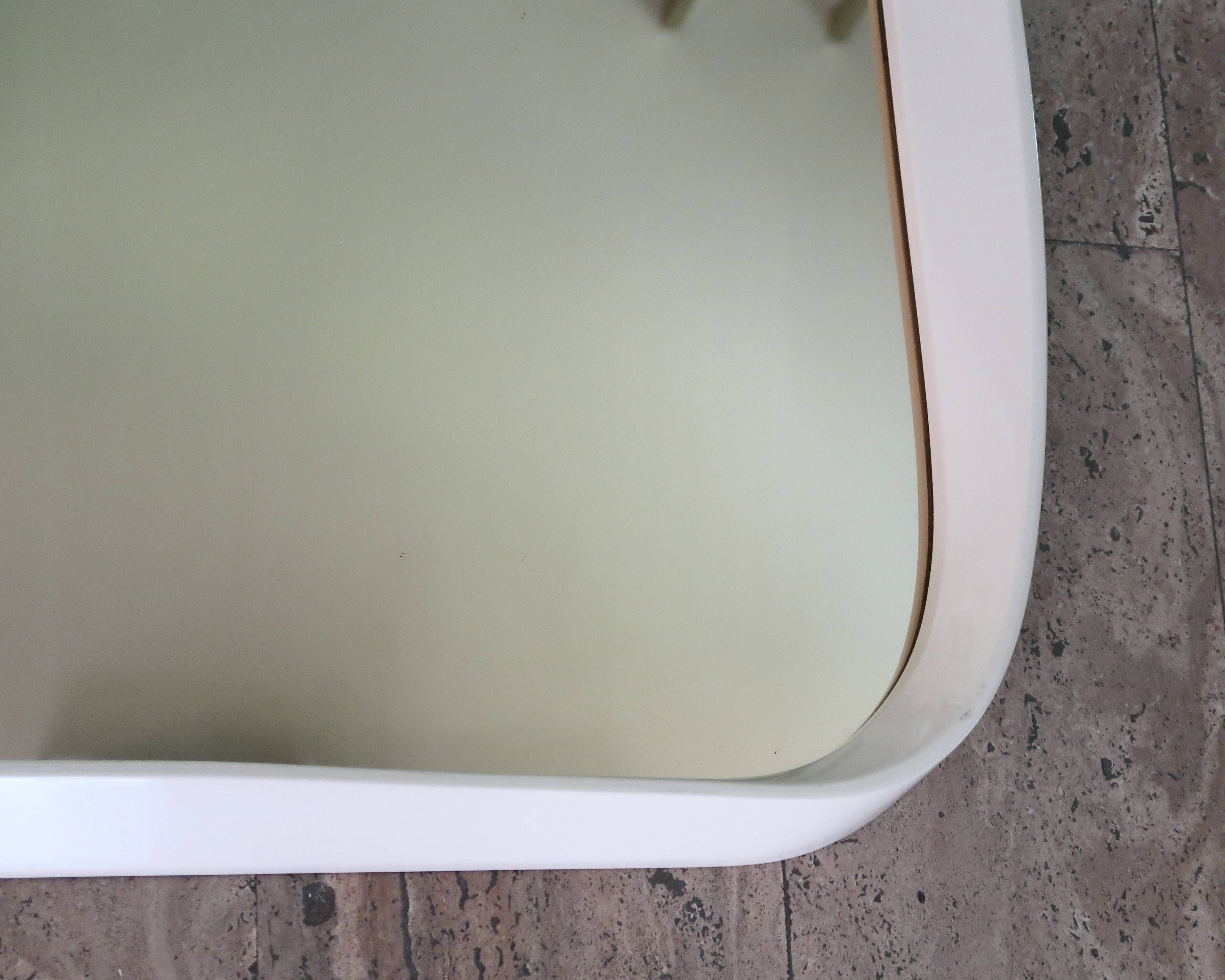 Rectangular mirror, horizontal or vertical, in white lacquered wood, 1970s.