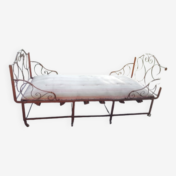 Old wrought iron folding bed