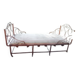 Old wrought iron folding bed