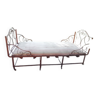 Old wrought iron folding bed