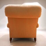 Deep seated armchair in the style of Howard & Sons