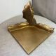 Small corner console in resin with a gold finish.