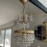 Cascade chandelier with crystal and brass tassels