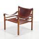 Deux fauteuils Arne Norell Sirocco en palissandre et cuir.