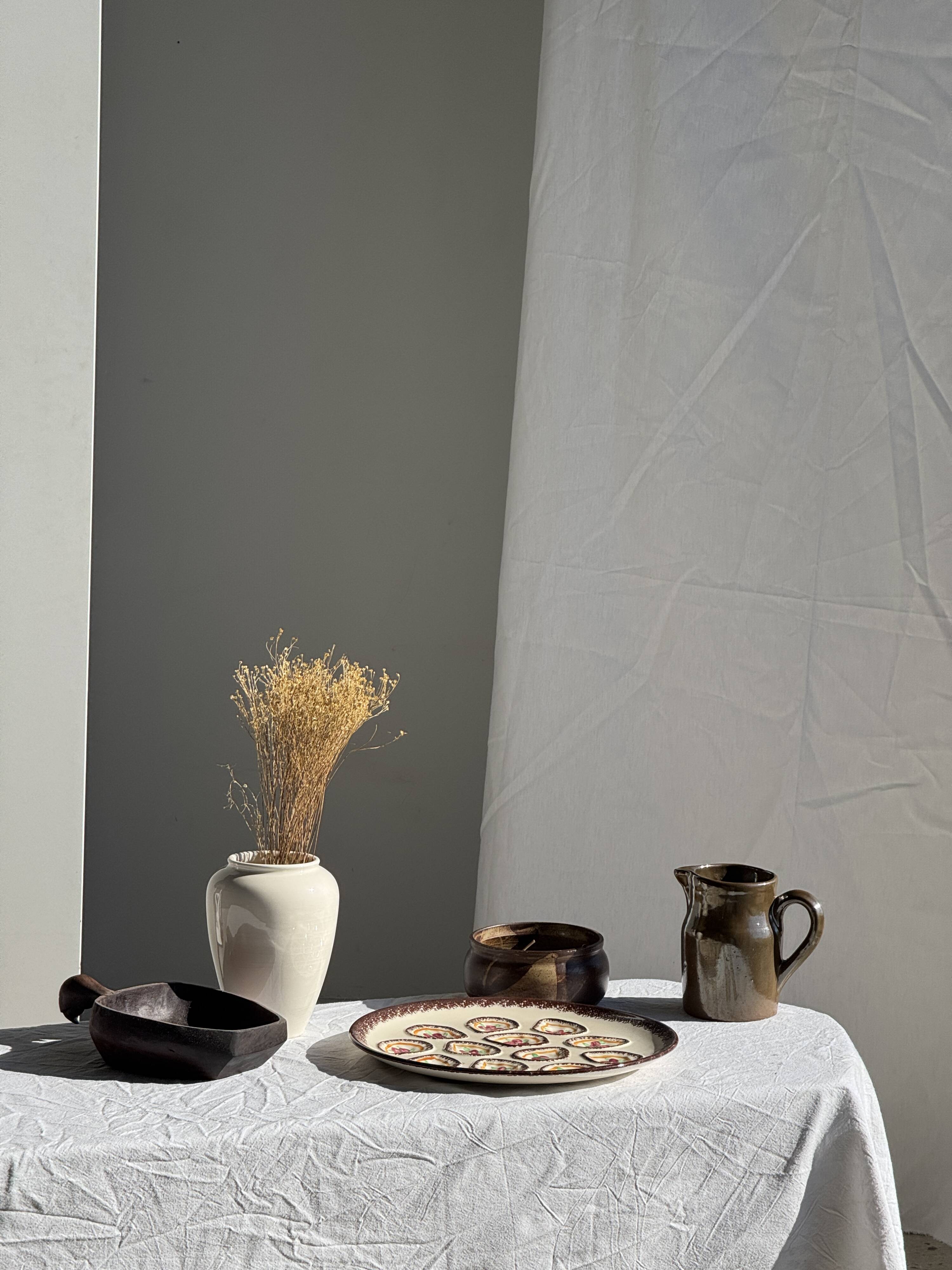 Large circular platter with compartments for shellfish, molluscs, and oysters.