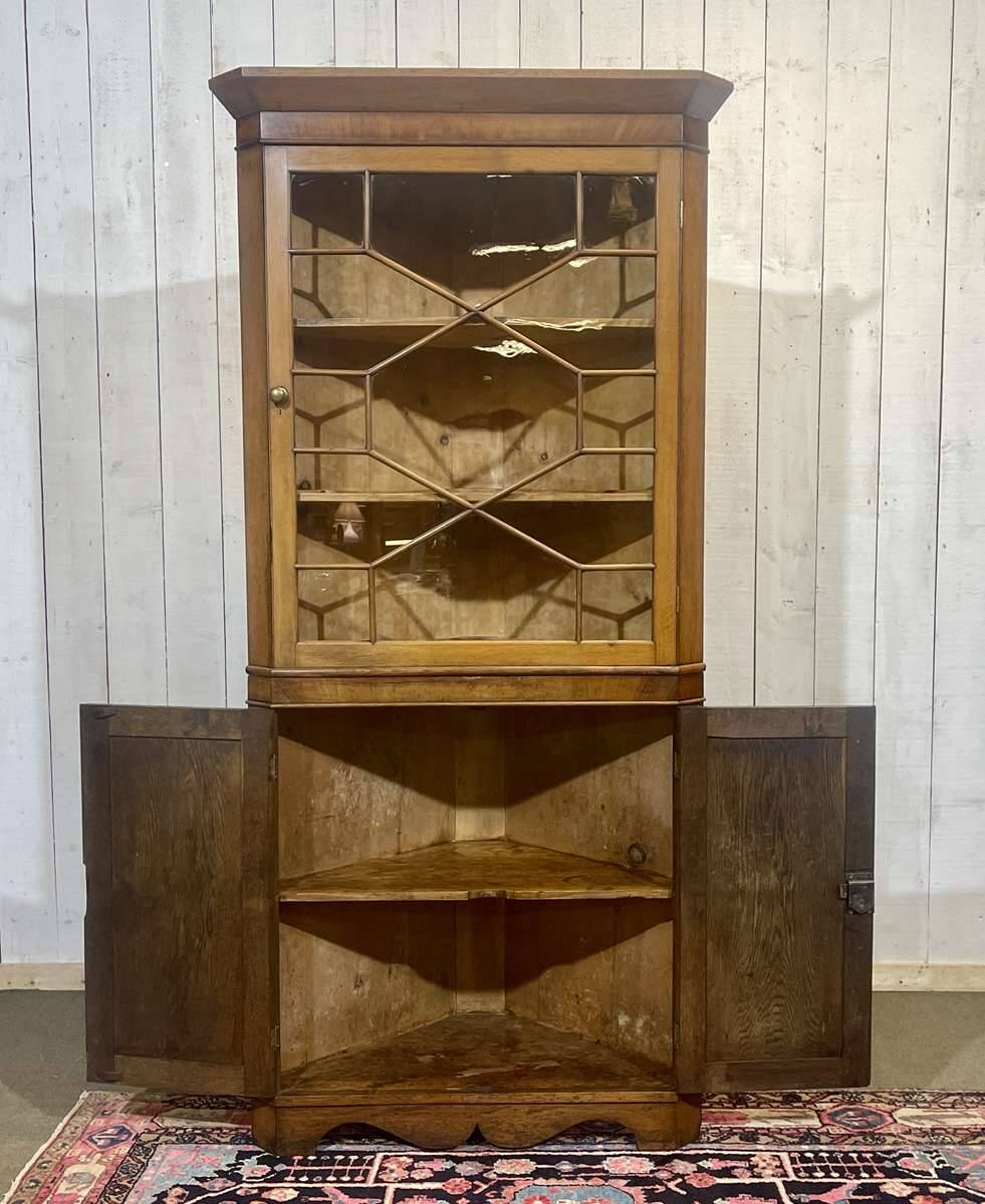 19th-century English corner cabinet in oak, mahogany, and fir.