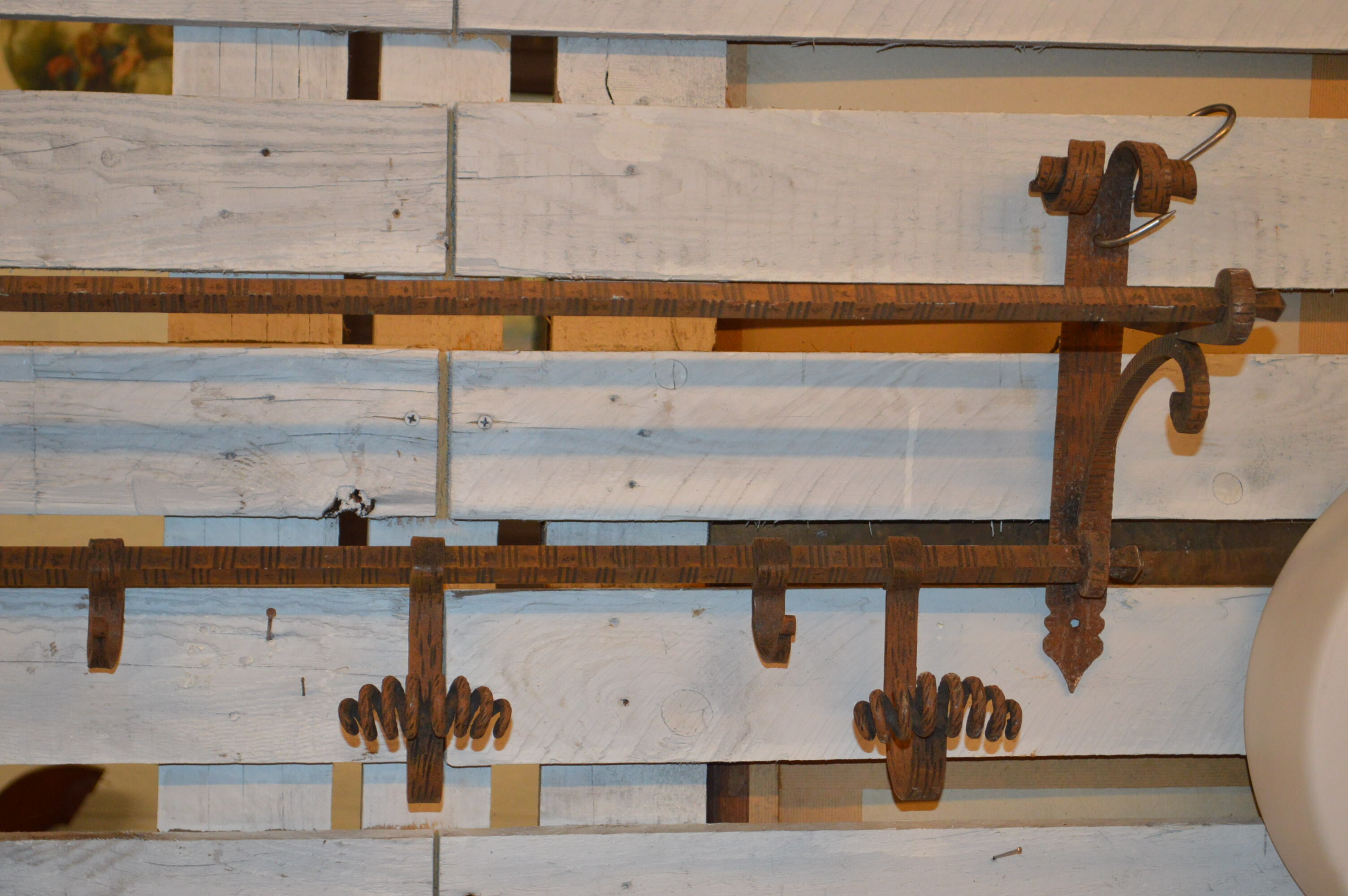 Coats in wrought iron door