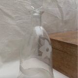 Old carafe with engraved flowers