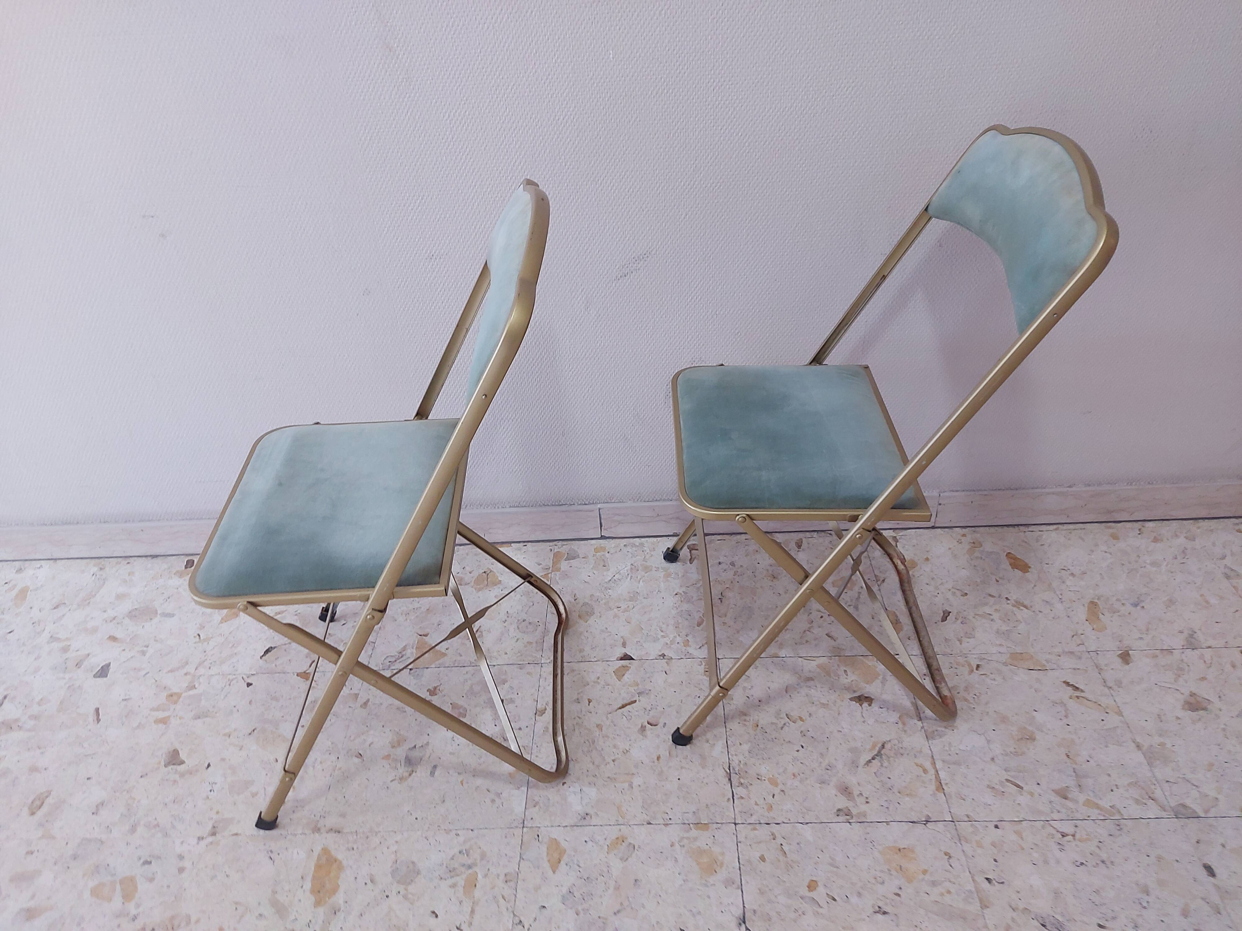 Two folding opera chairs in velvet