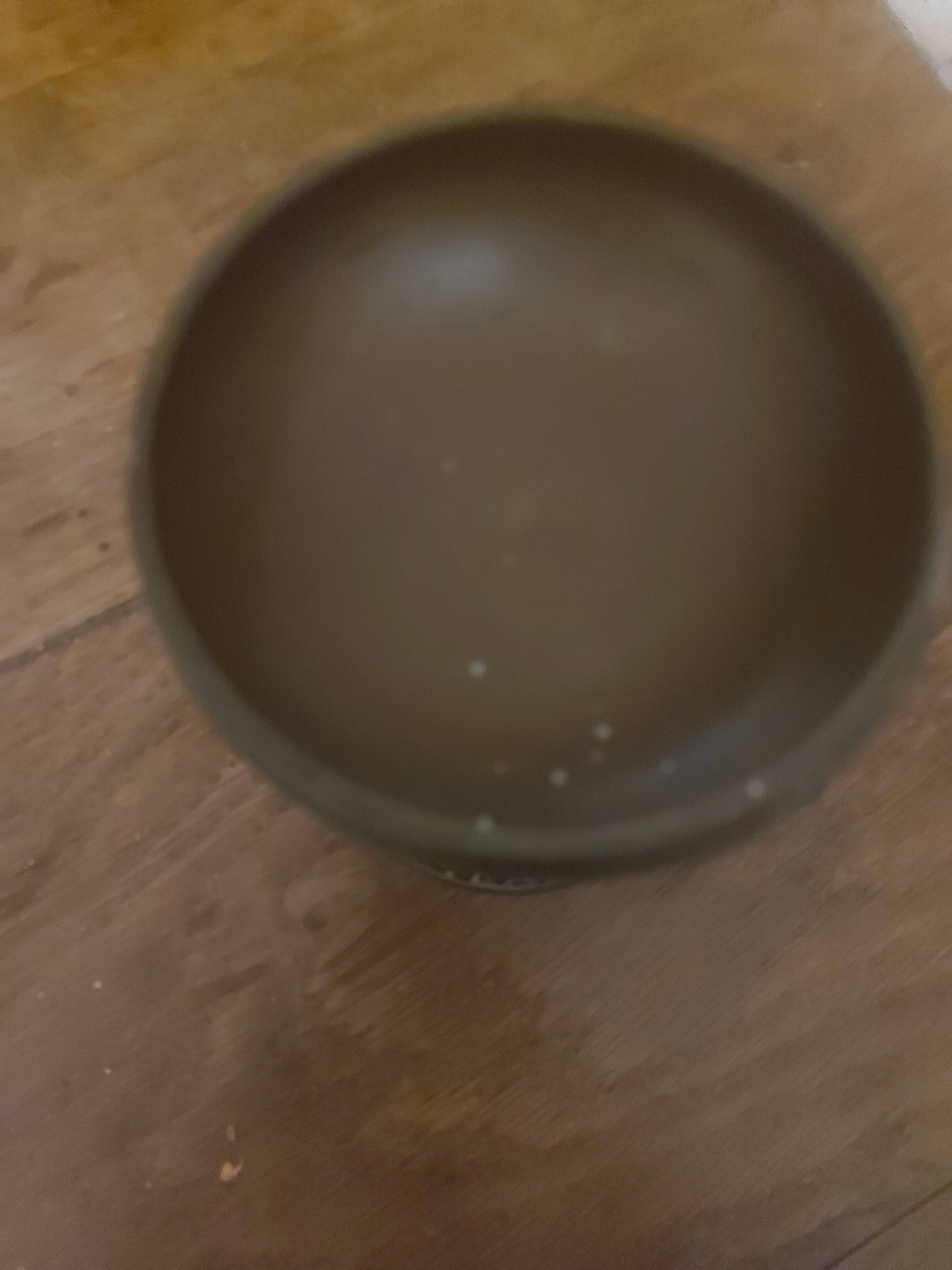 Bronze bowl on marble base