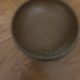 Bronze bowl on marble base