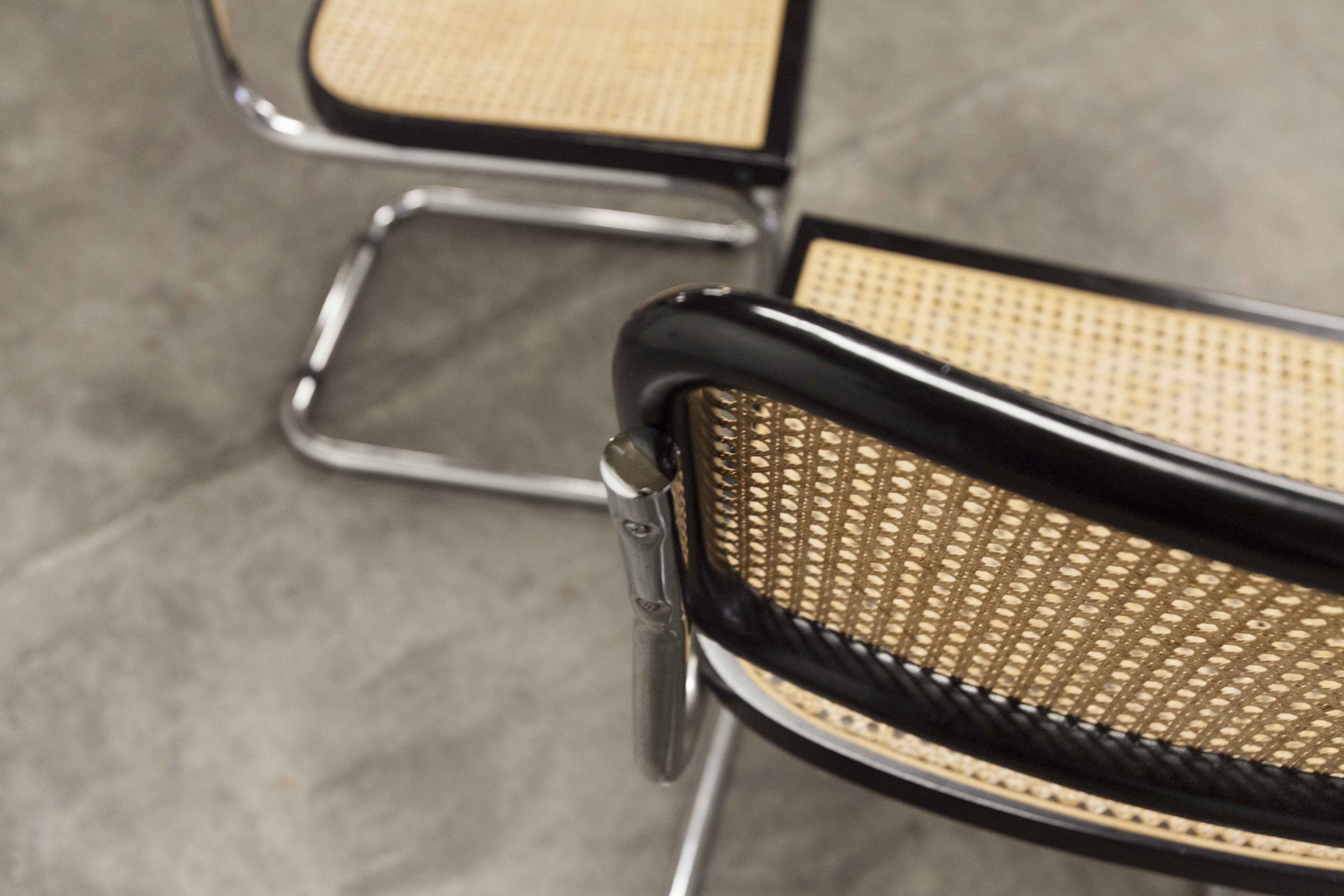 Pair of black Breuer b32 chairs and cannage