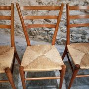 Set of 4 mid-century Italian dining chairs with woven seats, circa 1950–1970.