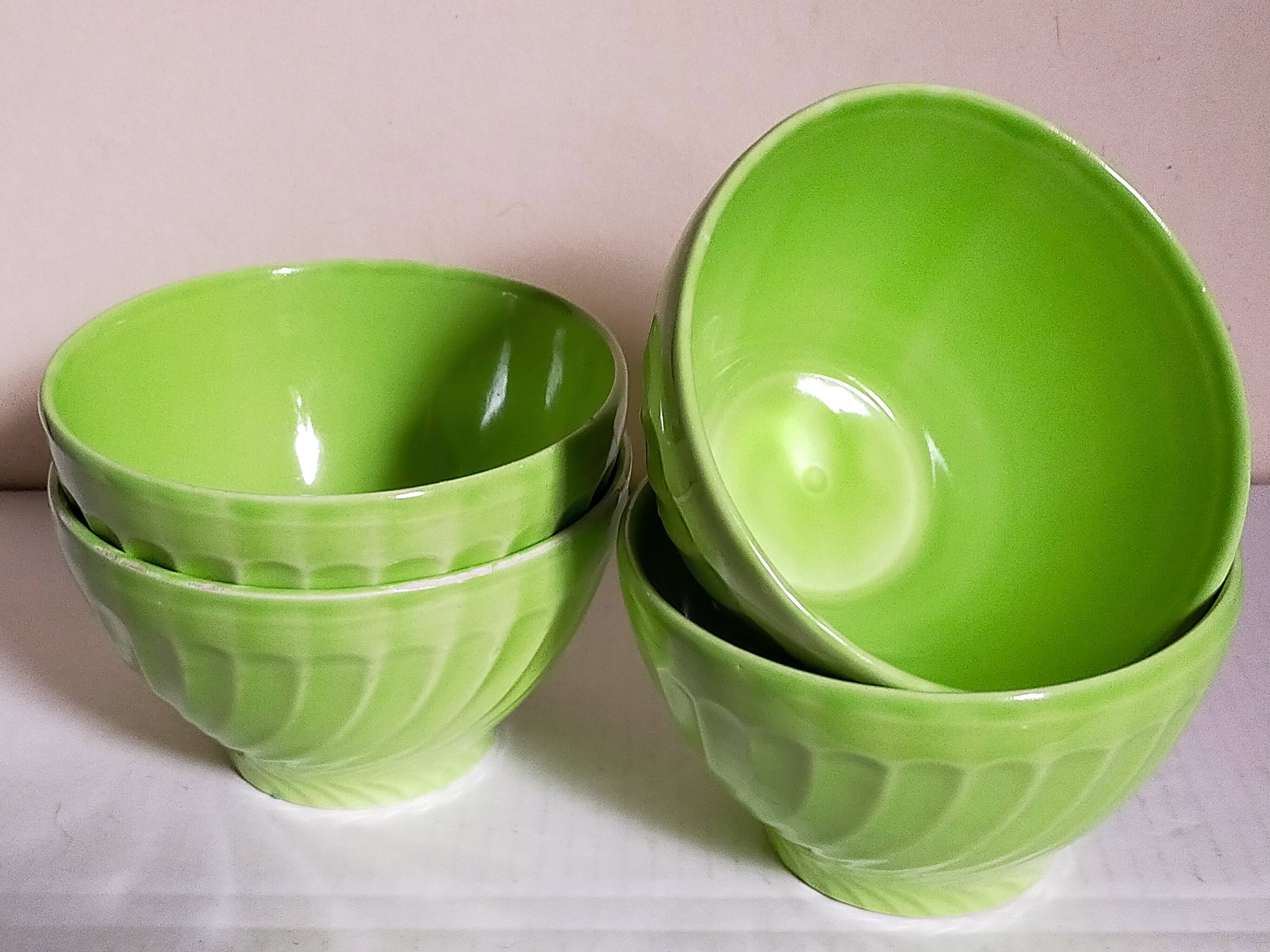 Four vintage spring green earthenware bowls