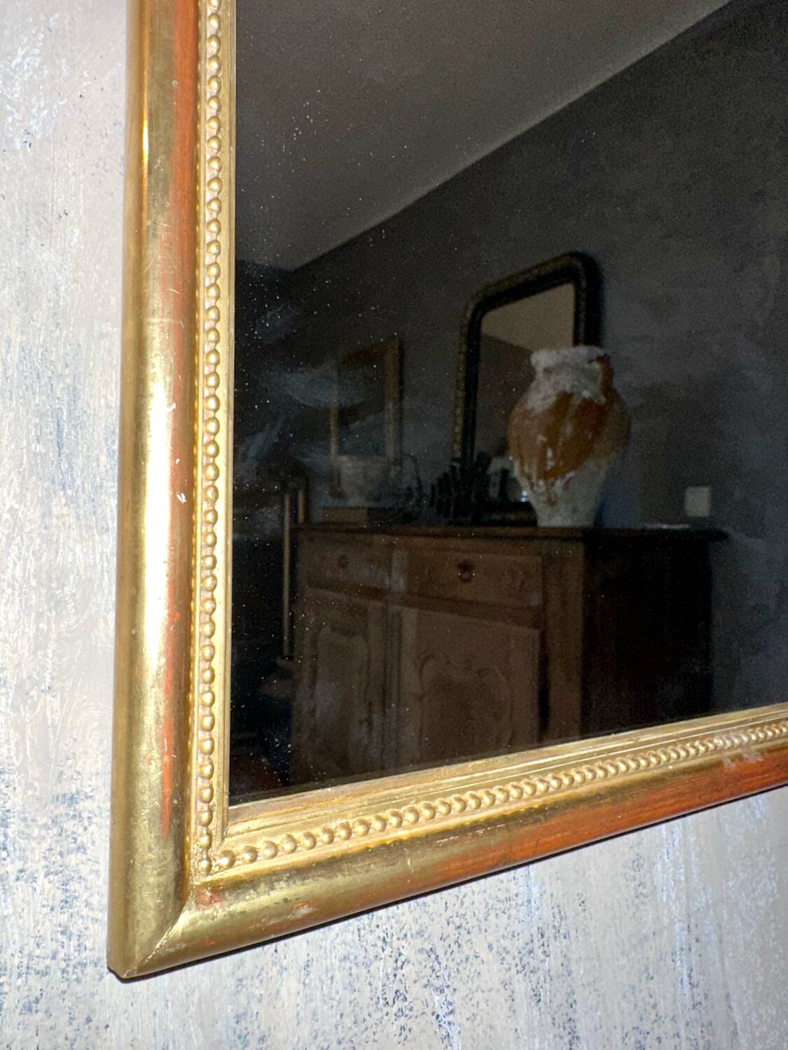 Antique beaded mirror with gold leaf