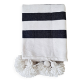 Hand-woven plaid with black stripes and white pompoms