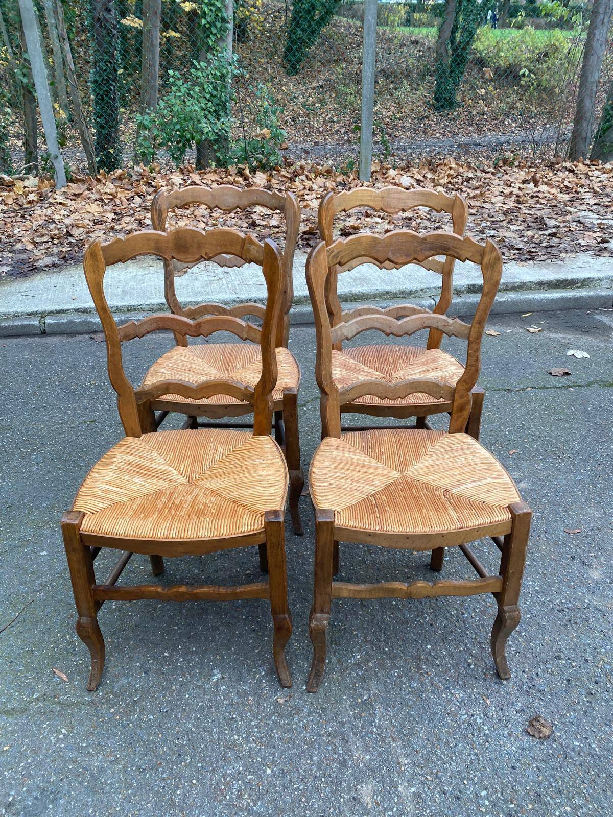 Four Louis XV chairs in solid oak and straw seats, 19th century