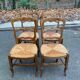 Four Louis XV chairs in solid oak and straw seats, 19th century