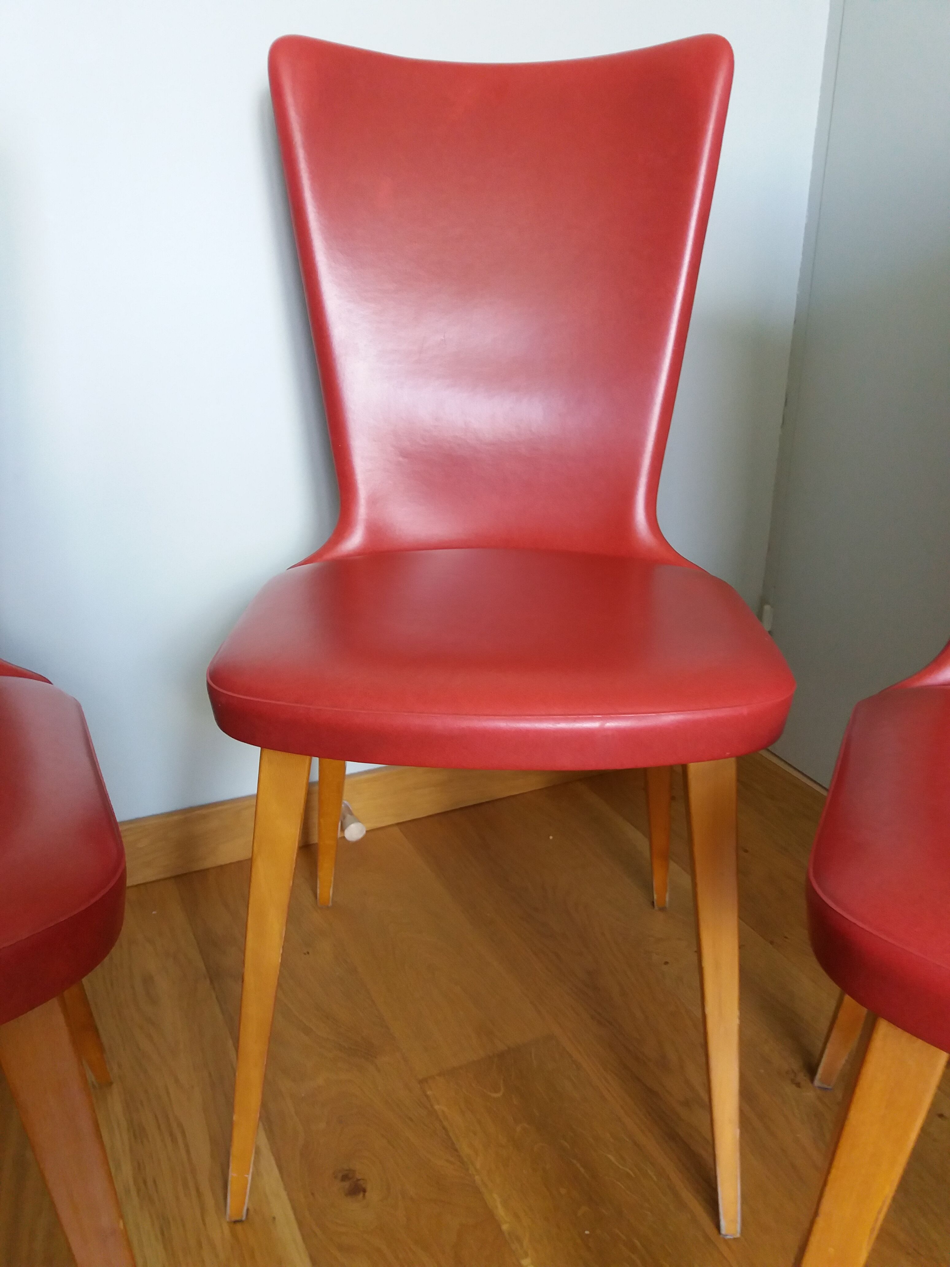 Baumann skai red imitation leather chairs from the 1950s