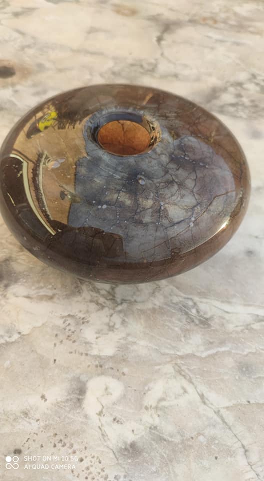 Flattened spherical vase made of glass paste
