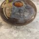 Flattened spherical vase made of glass paste