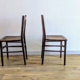 Pair of 1930s bistro chairs with patinated wood.