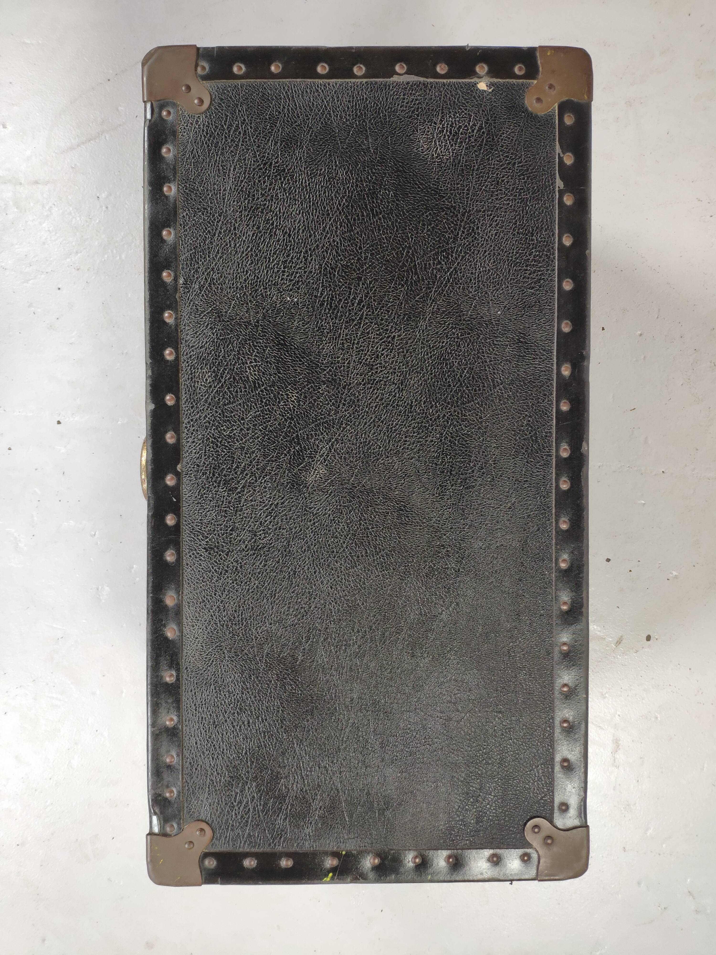 Old black trunk and brass