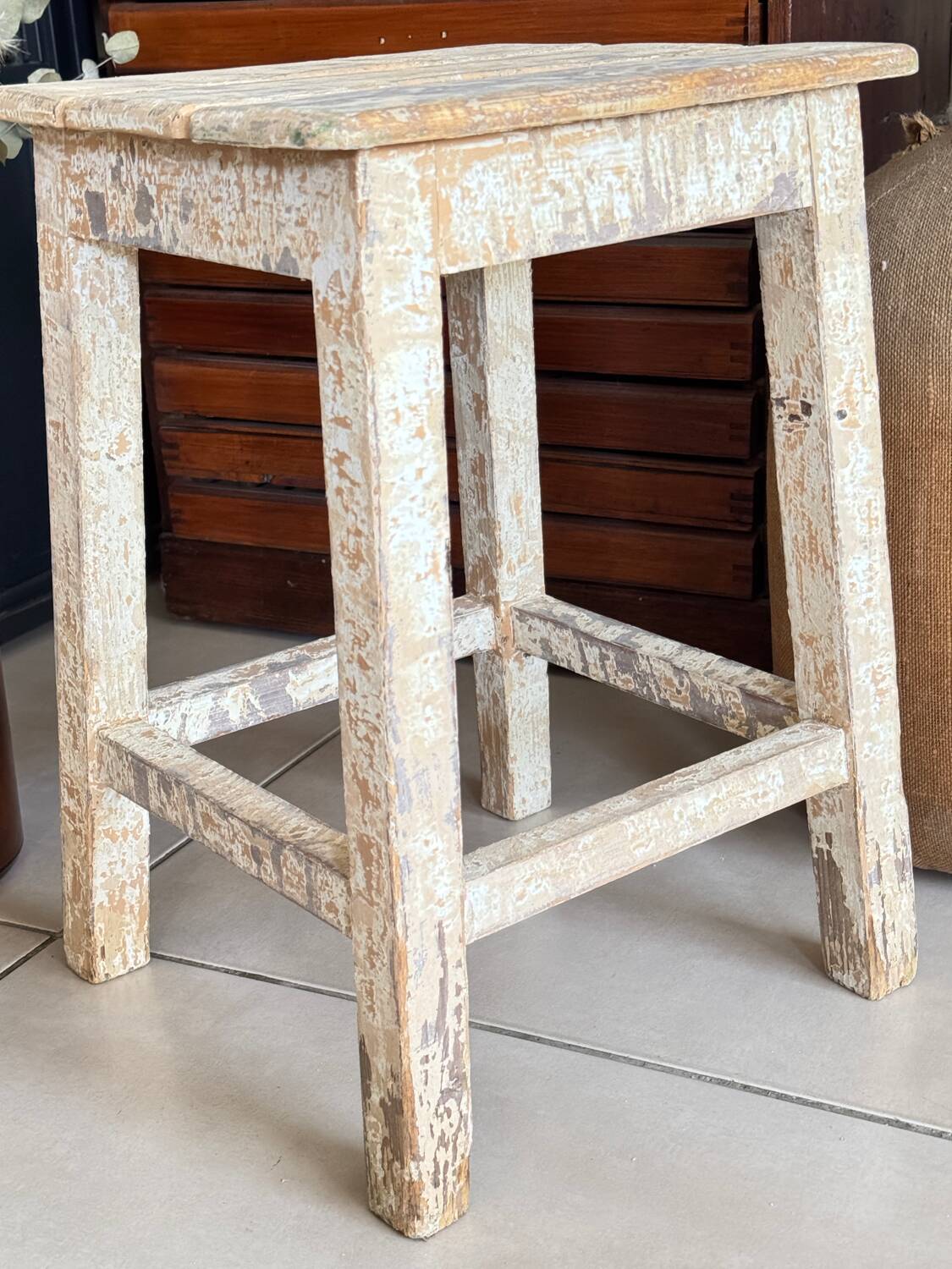 Old wooden stool with square seat